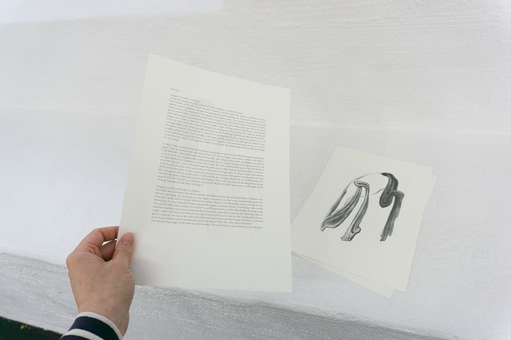 a text about containers and a painting of stripped off skin on the back